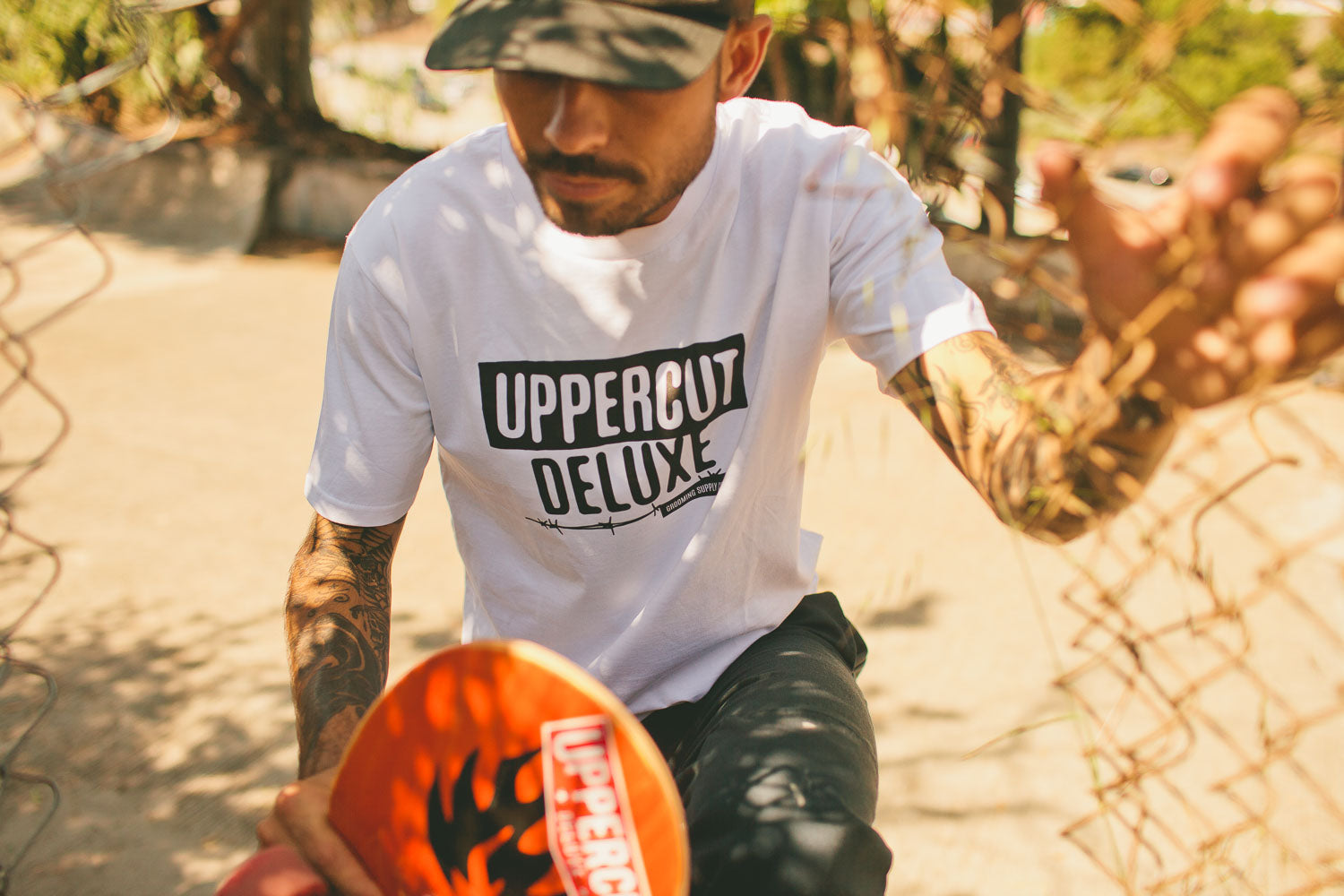 Man wearing Uppercut Deluxe Headliner Hat and Shirt